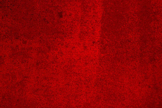 Bright Red Stained Concrete Wall Surface With Texture And Grit