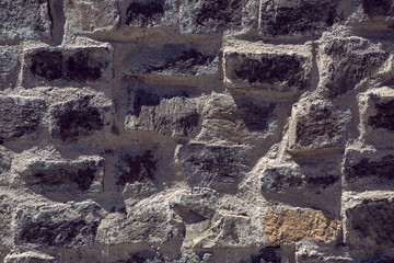 background of black stone old wall on the street