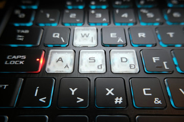 The gaming keyboard shines with multi-colored keys , enter button in center