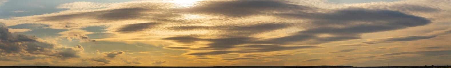 Leaden, storm clouds covered the sunset. Cumuliform cloudscape on blue sky. The terrain in southern Europe. Fantastic skies on the planet earth. Tragic gloomy sky.	
