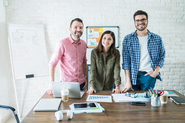 Smiling Business Team In Conference Room At Office