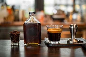 Black coffee in small shot .