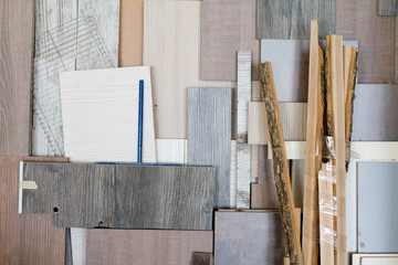 Wooden pillars and thick boards in the furniture workshop are ready to work joiner, selective focus