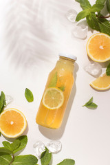 Summer refreshing detox lemonade on tropical bay background