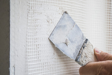 Putty wall reinforced with mesh.