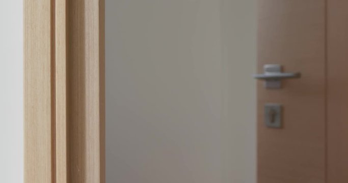 Man hand open the room door at home