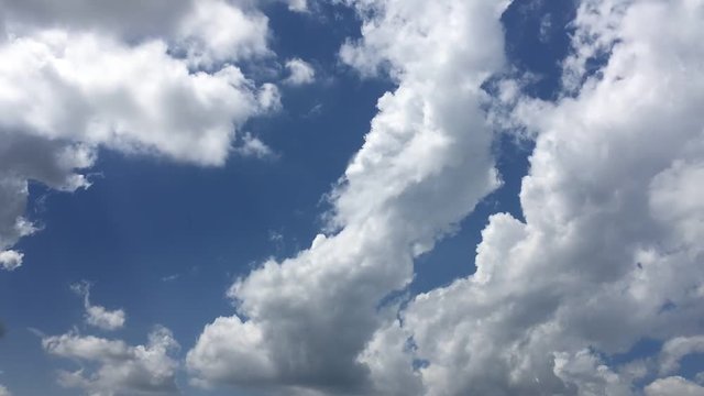 Time lapse video at noon, with the sky bright blue and white. Beautiful cloud movement during the day in very hot weather. Sky weather time lapse video with cloudy weather suitable for background.