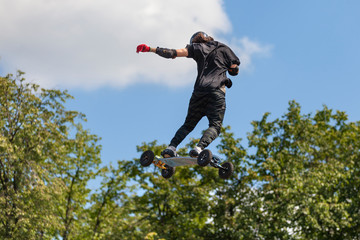 Extreme jumping on a mountainboard at the Moscow sports festival in Luzhniki. Danger, fall, shock