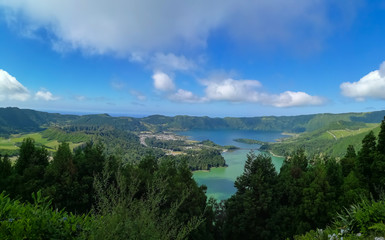 Fototapeta na wymiar Lagoa das Sete Cidades is located on the island of São Miguel, Azores and is characterized by the double coloration of its waters, in green and blue.