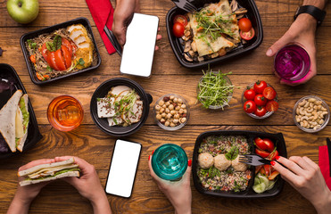 Family lunch at home with healthy meal in take away boxes