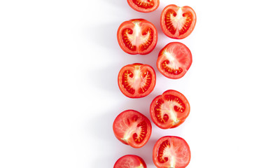 Tomato pattern. Frame made of fresh half tomatoes on white  background. Flat lay, top view, copy space