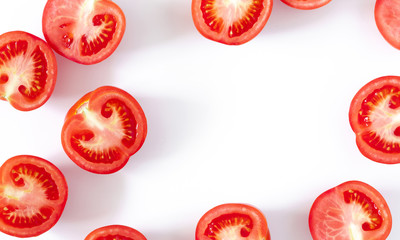 Tomato pattern. Frame made of fresh half tomatoes on white  background. Flat lay, top view, copy space