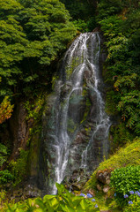 Obraz premium The Bridal Veil waterfall is located in the Northeast Volcanic Complex on São Miguel Island, Azores
