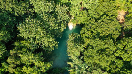 Aerial drone photo of famous mountain lake and waterfall in Polilimnio area in Messinia, Peloponnese, Greece