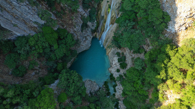 Aerial drone photo of famous mountain lake and waterfall in Polilimnio area in Messinia, Peloponnese, Greece