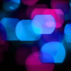 festive background.blurred colored lights on a black background