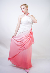 portrait of short-haired plump woman in pink evening dress with ombre fabric