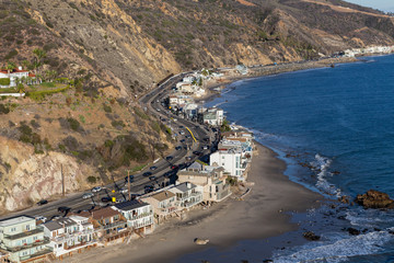 Aerial of beach homes along curving section of Pacific Coast Highway near Los Angeles and Malibu in...