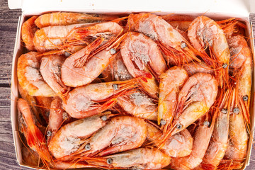 Atlantic frozen prawns in blocks on the table