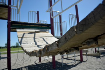 Colourful playground bridge and hand rail in school yard.