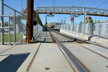 Naklejka premium Pedestrian transit train track line at city station.