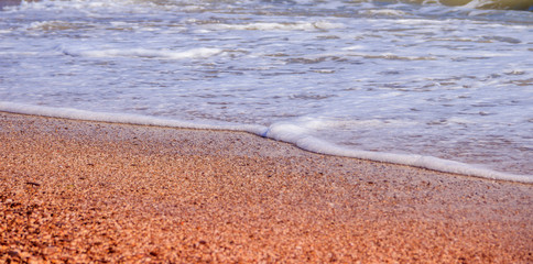 Sea waves. Sea of Crimea. High waves in clear weather. Sunny day at sea. Background blue sea waves. Sand beach. Clean beach.