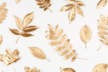 Autumn composition. Pattern made of autumn golden leaves on white background. Flat lay, top view, copy space