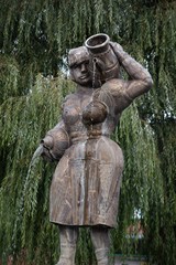 Fototapeta na wymiar Statue of a woman carrying water