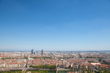 Fototapeta na wymiar Aerial panoramic view of Lyon with the skyline of Lyon skyscrapers visible in background and Saone river in the foregroud, with the narrow streets of Old Lyon district 