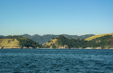 Fototapeta na wymiar Green mountains on the coast