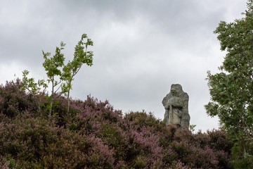 Statue of man against a white sky in Scotland
