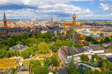 Aerial view of the Tivoli Gardens amusement park with people, visitors, attractions and rides....