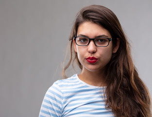 Young dark haired woman wearing glasses