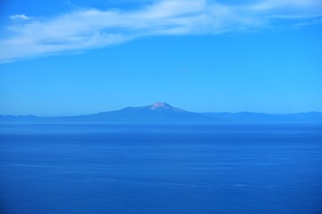 Fototapeta na wymiar 室蘭地球岬から内浦湾越しに見た駒ケ岳の雄姿