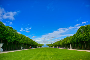 Versailles, France - April 24, 2019: The statues and fountains in and around the garden of Versailles Palace on a sunny day outside of Paris, France.