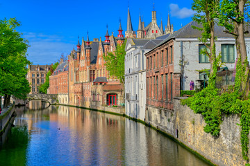 Fototapeta premium The canals of Bruges (Brugge), Belgium on a sunny day.