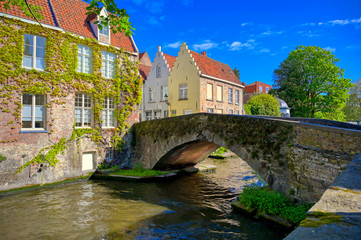 Fototapeta premium The canals of Bruges (Brugge), Belgium on a sunny day.