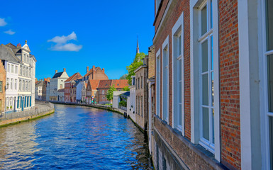 Fototapeta na wymiar The canals of Bruges (Brugge), Belgium on a sunny day.