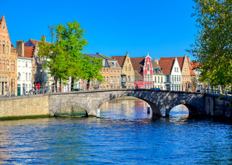 Fototapeta premium The canals of Bruges (Brugge), Belgium on a sunny day.