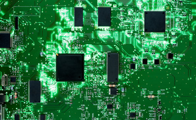 Backlit green printed circuit board background texture