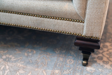 close up design part of sofa detail arm rest leg and upholsty fabric trim finishing furniture deisgn ideas concept