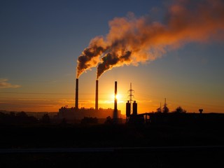 power plant at sunset