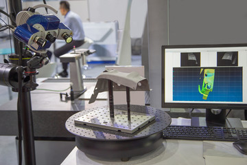 Optical 3D coordinate measuring machine scanning workpiece. Industrial manufacturing
