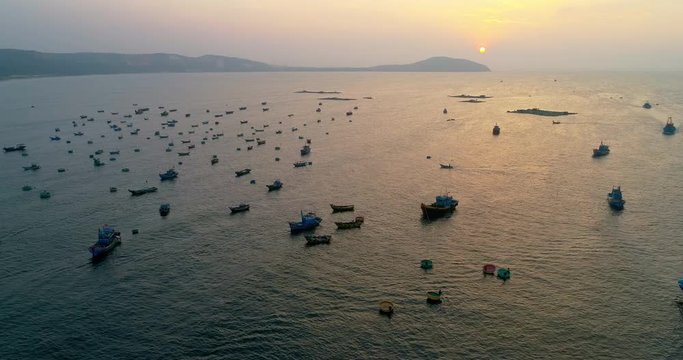 Top view, aerial view sunrise. Royalty high quality free stock footage of Mui Ne fishing harbour or fishing village. Mui Ne fishing harbor is a popular tourist destination. Phan Thiet city, Vietnam