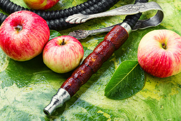 Smoking hookah with apple