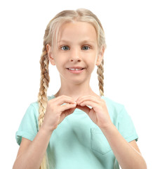 Little deaf mute girl using sign language on white background
