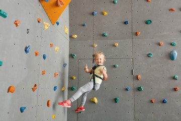 Cute little girl in climbing gym