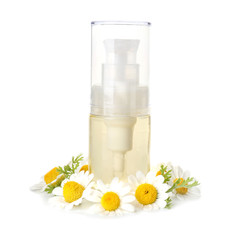 Obraz na płótnie Canvas Bottle of essential oil with chamomile flowers on white background