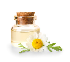 Bottle of essential oil with chamomile flower on white background