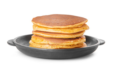 Frying pan with tasty pancakes on white background
